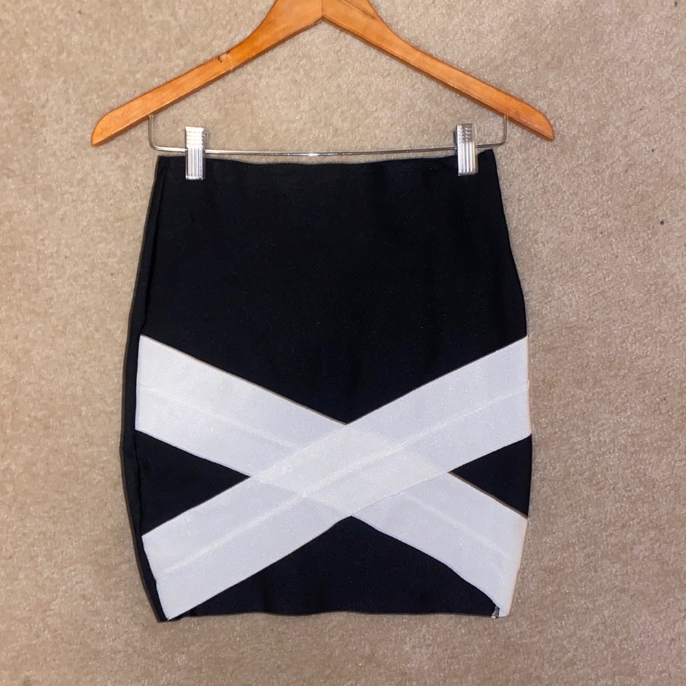 Body-con mini skirt. Size medium. Black with white criss cross